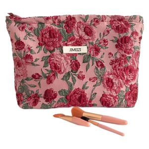 Pink floral jacquard toiletry bag with red roses and zipper closure for cosmetics