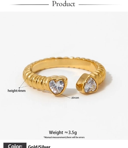 Macro view of adjustable threaded heart ring with sparkling zircon stones in gold and silver