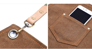 Detail view of brown canvas apron with reinforced metal hardware and leather straps