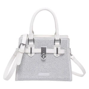 White rhinestone encrusted handbag with silver metal hardware and leather shoulder strap