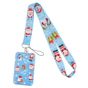 Close-up of light blue Christmas lanyard and card holder set with Santa and Snowman