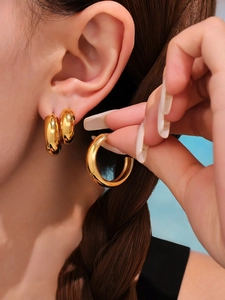 Three sizes of 18K gold plated stainless steel C-shape earrings shown on model