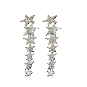 Silver star tassel drop earrings with sparkling rhinestones in a long dangling design