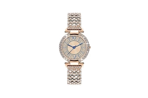 Detail of rose gold watch face with blue hands, crystals, and Roman numeral markers