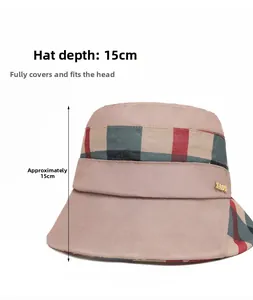 Detail view of pink plaid bucket hat with 15cm depth and gold LOVE metal letter