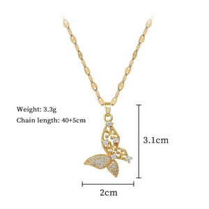 Detailed view of a gold butterfly pendant with sparkling zircons and dimensions marked