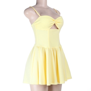 Macro shot of pale yellow summer dress featuring front knot detail and cut-out design