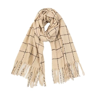Detail of beige plaid scarf with fringe edges and soft knitted warm texture