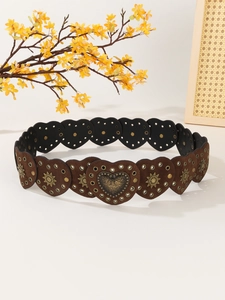 Detail of brown heart-shaped suede belt with golden sun star studs and metal rings