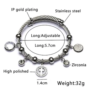 Bracelet extensible en acier argenté avec breloque croix et cristaux brillants