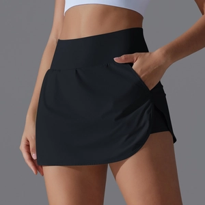 Detail view of high waisted black tennis skort showing side pocket and layered hem
