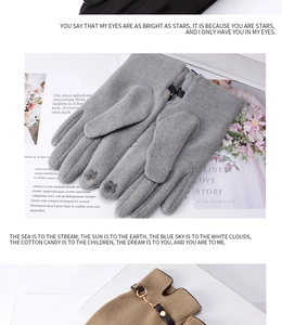 Close-up of winter touch screen gloves with clover embroidery and metal horsebit buckles