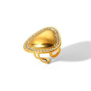 Detailed view of an adjustable gold ring featuring a sparkling triangle-shaped crystal setting