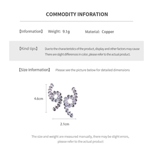 Macro view of spiral teardrop earrings with detailed size measurements 4.6cm by 2.1cm