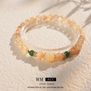 Bracelet chinois en perles ambrées avec citrine jaune et détails en zircon doré