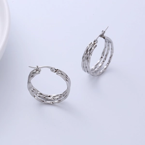 Polished silver triple-layer spiral hoop earrings featuring a stylish minimalist wire design