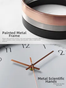 Detail of rose gold painted metal frame and precision pointers of quartz wall clock