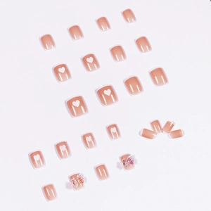 Press-on nails featuring nude pink base, white French tips, hearts and 3D butterfly charms