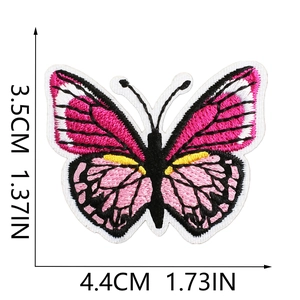 Detailed macro view of pink and black butterfly embroidered patch with dimensions 3.5x4.4cm