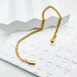 Detail of 14k gold plated stainless steel Cuban chain with a secure lobster clasp
