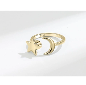 Detailed macro view of S925 hallmark on gold spinning star and moon adjustable ring
