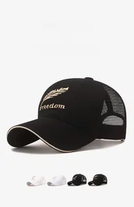 Close-up of golden feather and Freedom embroidery on mesh baseball cap detail