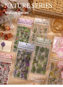 Detail of vintage PET floral stickers featuring roses and lavender on a beige linen fabric