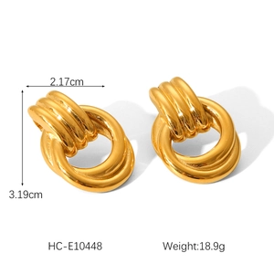Detail view of gold twisted interlocking hoop earrings with measurements and weight