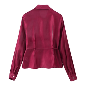 Rear view of fuchsia silk satin shirt with tailored back seams and curved hemline