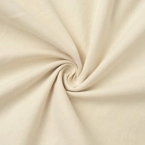 Detailed close-up of cream cotton blend fabric showing soft spiral texture and weave