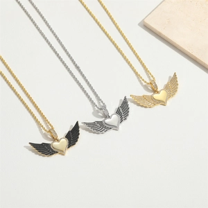 Detailed display of heart wing pendants with sparkling zircon in gold and silver finishes