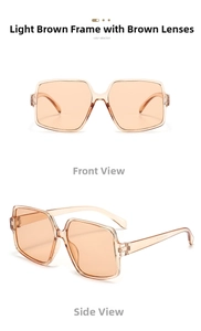 Detail view of oversized irregular tea-colored sunglasses with square frames