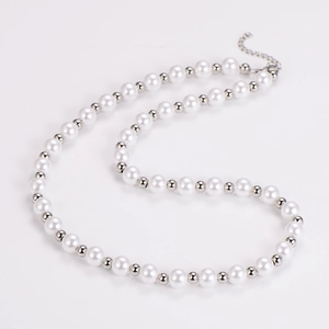 Detailed view of vintage pearl necklace with silver beads and lobster clasp on white background