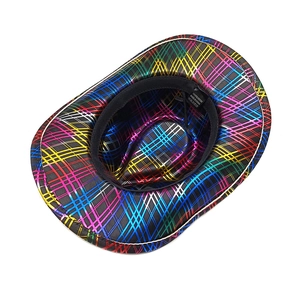Detail view of polyester cowboy hat showing colorful grid texture and 100% polyester label