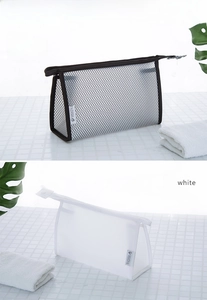 Detail of waterproof nylon mesh travel toiletry bags with zipper in black and white colors