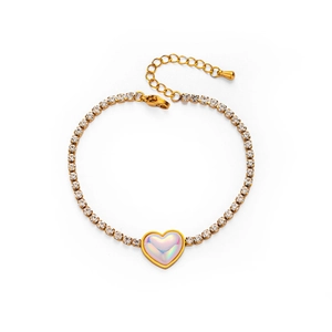 Detail of gold titanium heart bracelet with opal main stone and white rhinestones