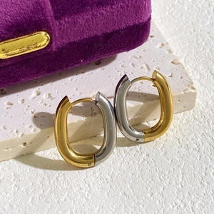 U-shaped two-tone gold and silver stainless steel earrings in minimalist oval design