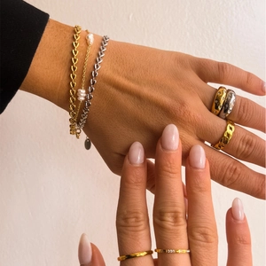 Bracciali a cuore sovrapposti in oro 18 carati e argento con perle e anelli motivo stella