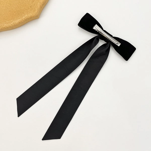 Elegant black velvet bow hair clip with long satin ribbons and silver metal duckbill grip