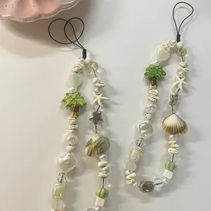 Summer shell and pearl beaded phone wrist strap with coconut tree charm and star accents