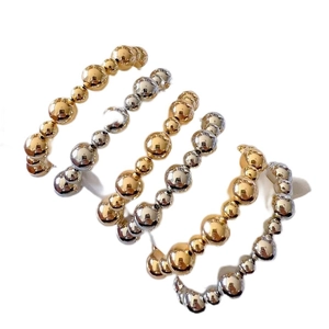 Polished 6mm and 10mm gold and silver beaded bracelets for a trendy minimalist style