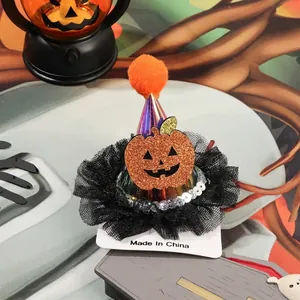 Close-up of purple Halloween cone hat with pumpkin face, orange pompom and black lace trim