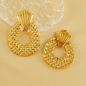 Elegant 18K gold-plated geometric drop earrings with rhombic texture on silk background