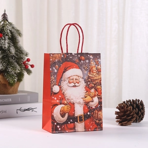 Detail of Christmas gift bag featuring Santa Claus print and red twist rope handle