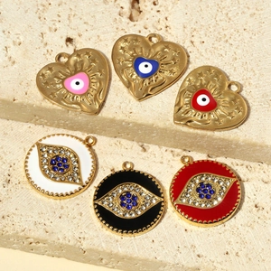 French geometric heart and round titanium steel charms with enamel evil eye detail