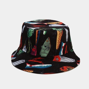 Detail view of fisherman hat featuring colorful fish and lure patterns on black fabric