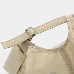 Detail of khaki quick-dry docker hat featuring white stitching and metal buckle strap