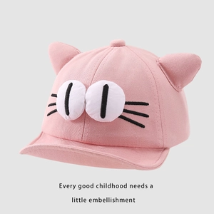 Detail of pink cotton baby baseball cap featuring cute cat ears and face embroidery