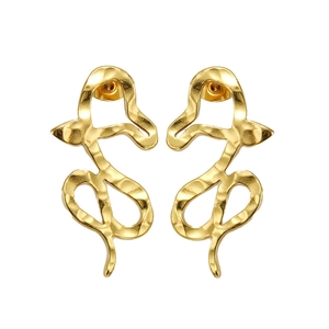 Detailed close-up of golden stainless steel snake earrings with hammered metal texture