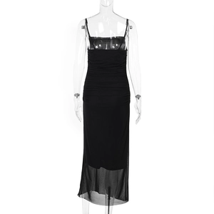 Detail showing sheer mesh hem and sleek slit of this black bodycon slip dress for women